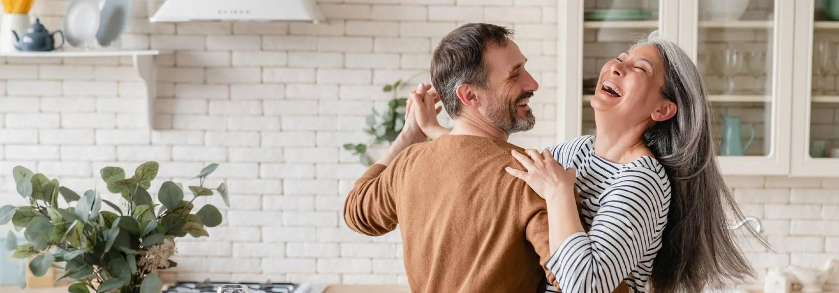 couple dancing in the kitchen